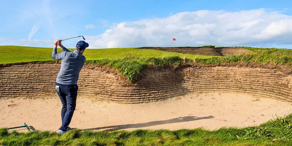 Man swinging a golf club