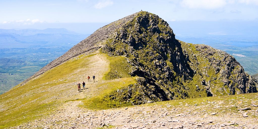People climbing the peak of the mountain