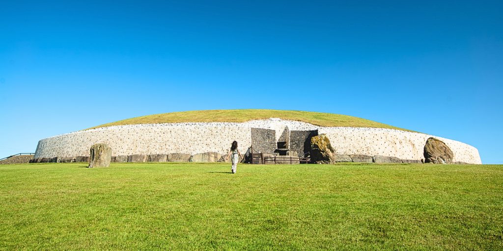 Tourist walking towards Newgrange