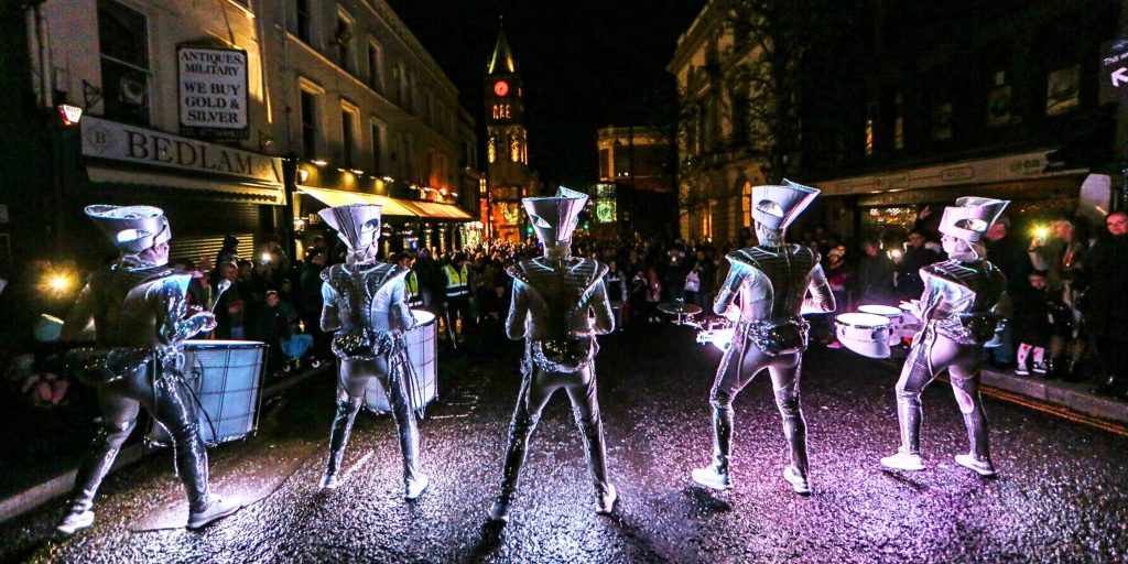 Festival performers in front of a crowd