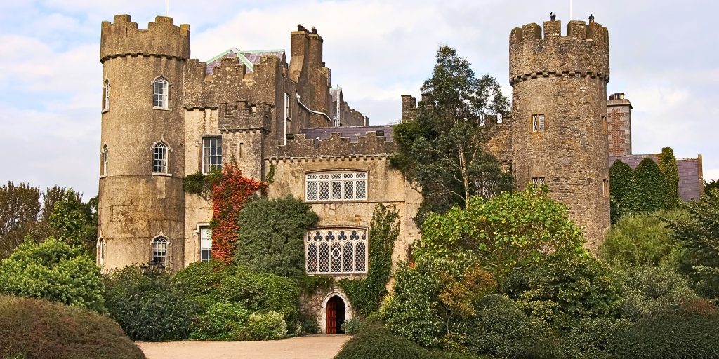 Front entrance of Malahide Castle covered in ivy