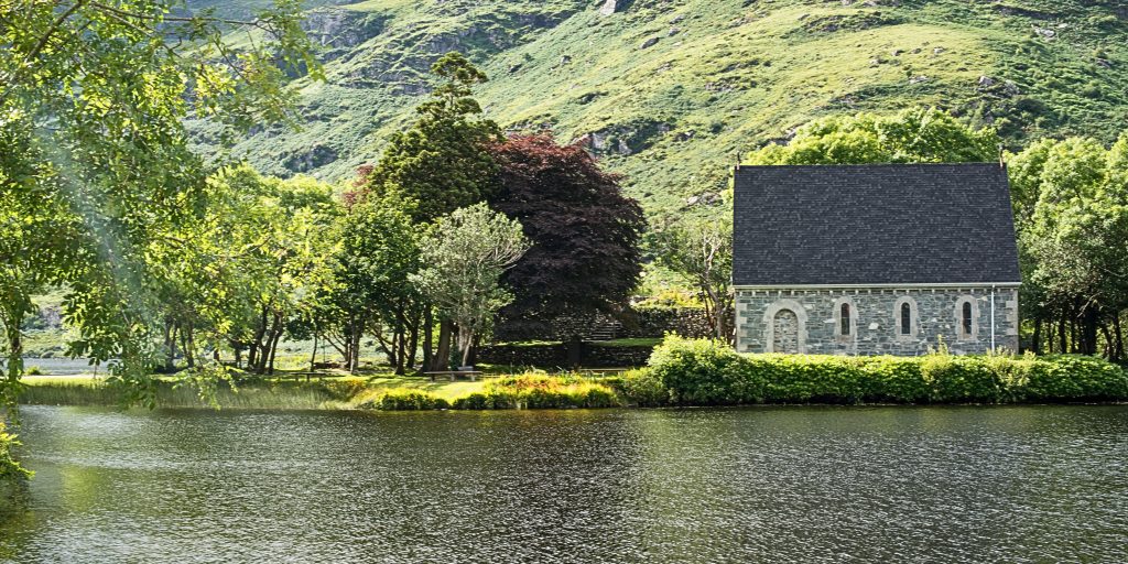 Christian monastery sitting beside a lake