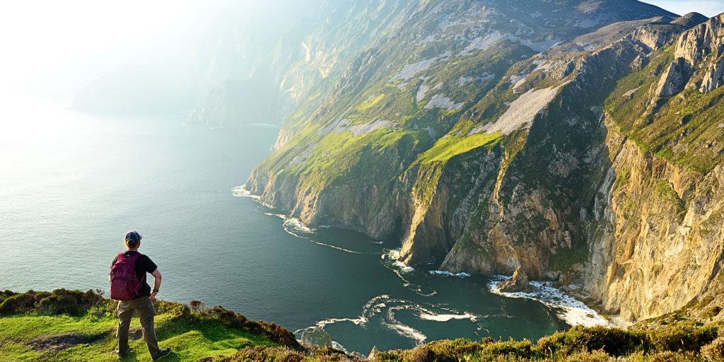 A man facing the Slieve League cliffs